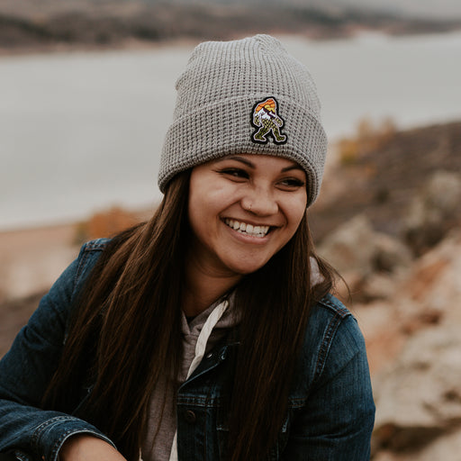  Woman wearing grey beanie featuring our yeti design.